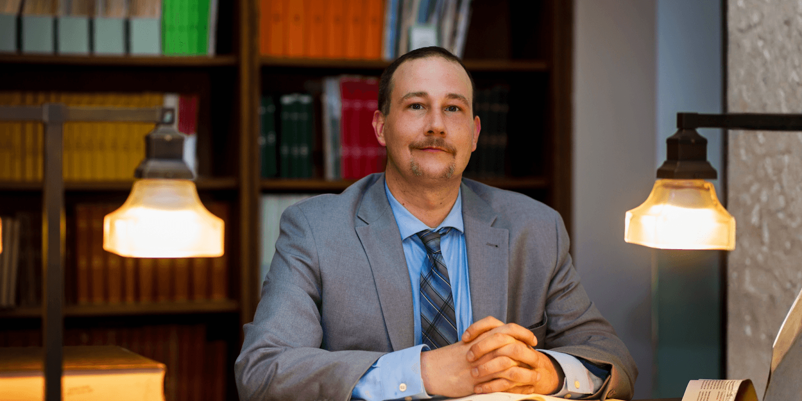 Wm. Marcus Wilkerson, a Southeast Texas attorney, sitting confidently in a professional setting, exemplifying expertise and dedication.