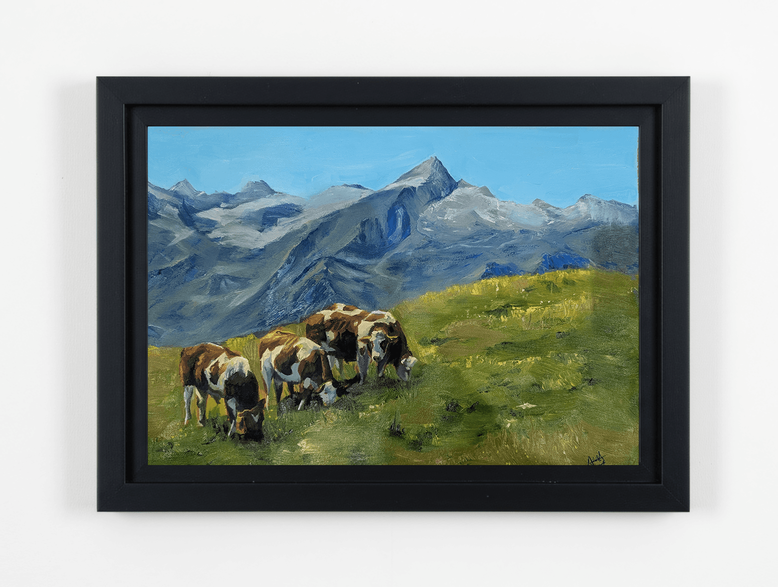 A close-up of a hand wearing multiple decorative rings against a blue background.