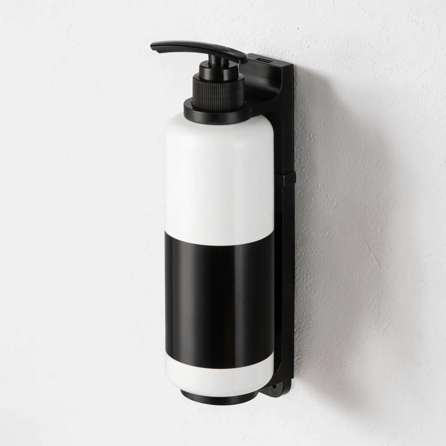 Eco-friendly tamper-proof soap dispenser bracket for hotel refillable systems, high-quality stainless steel, compatible with 300ml-500ml bottles.