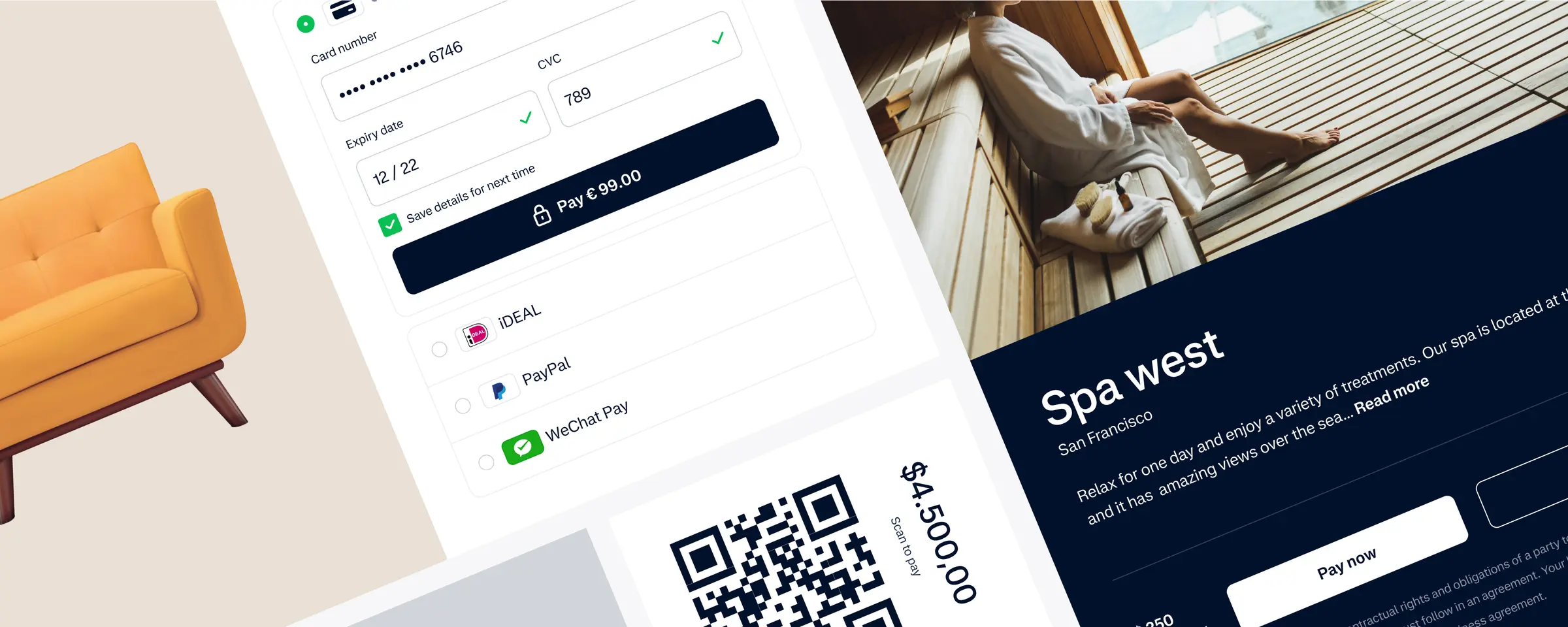 A young person with curly hair smiles at the camera while sitting in front of a laptop against a dark background.