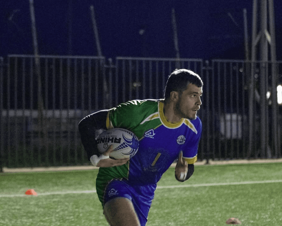 photo of player runnning with ball