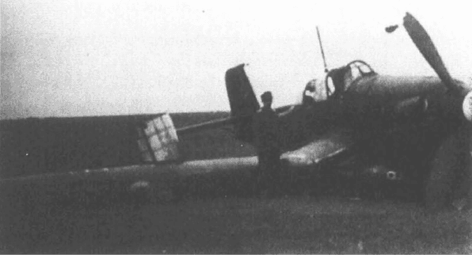 A person standing next to a plane
AI-generated content may be incorrect.