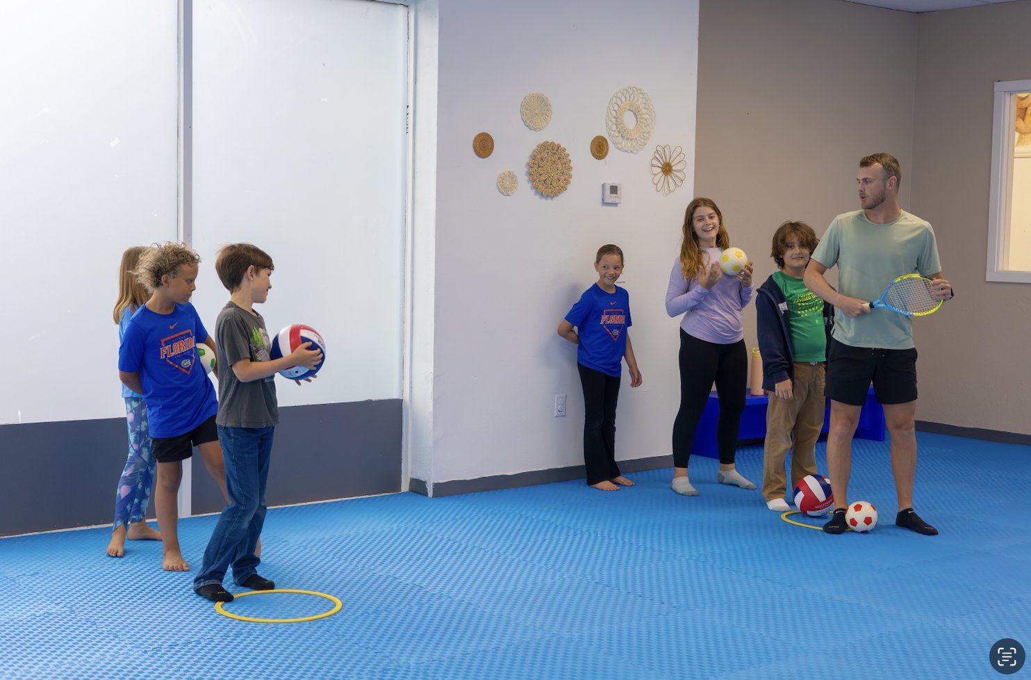 Children playing in the open soft play space
