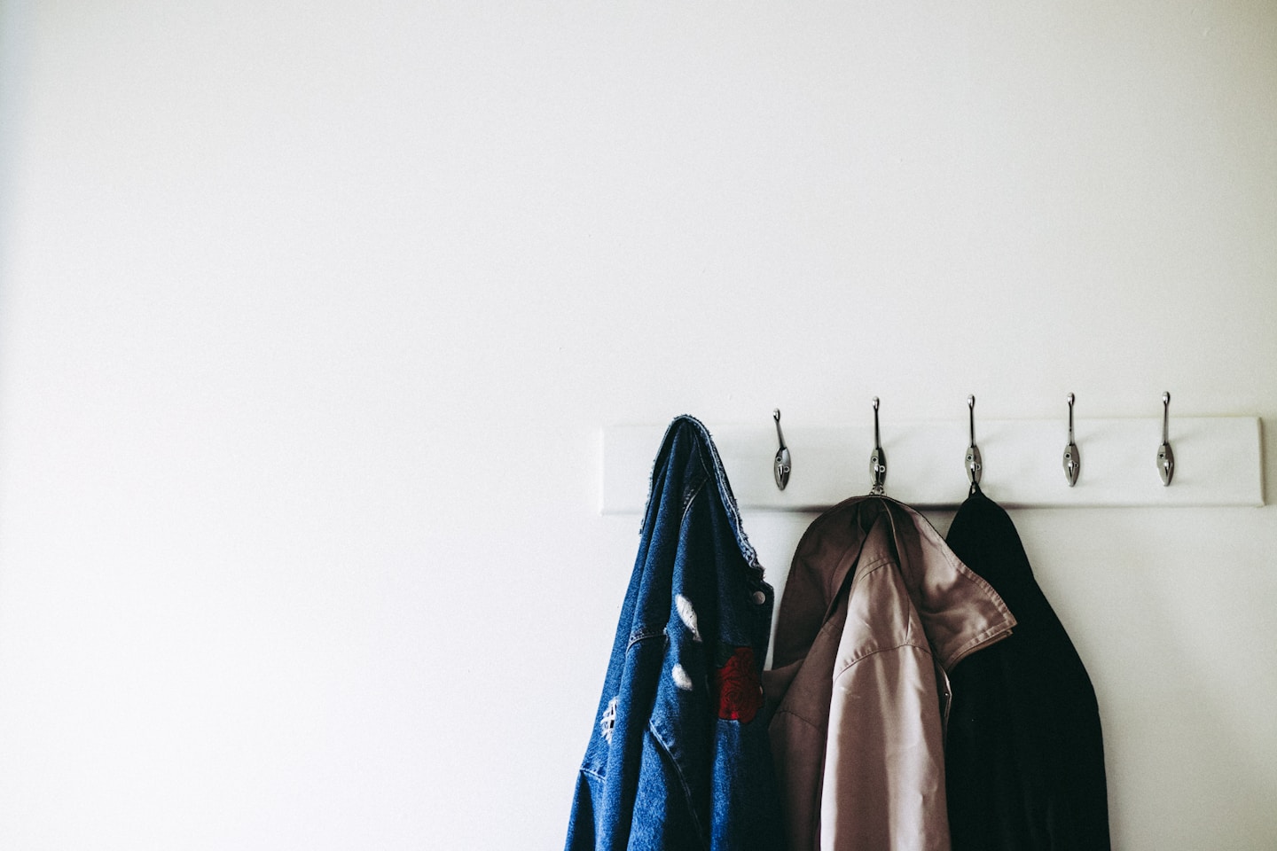 Coats on hooks, most of them inherited