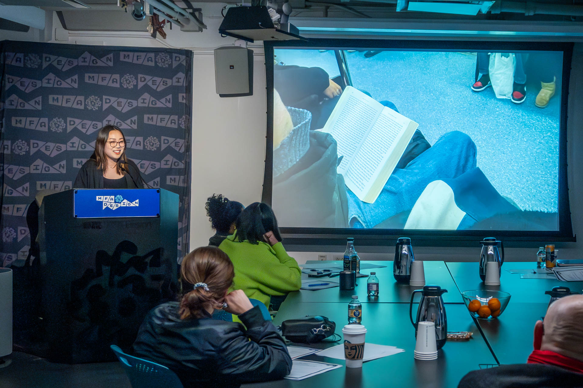 student at a podium giving a presentation