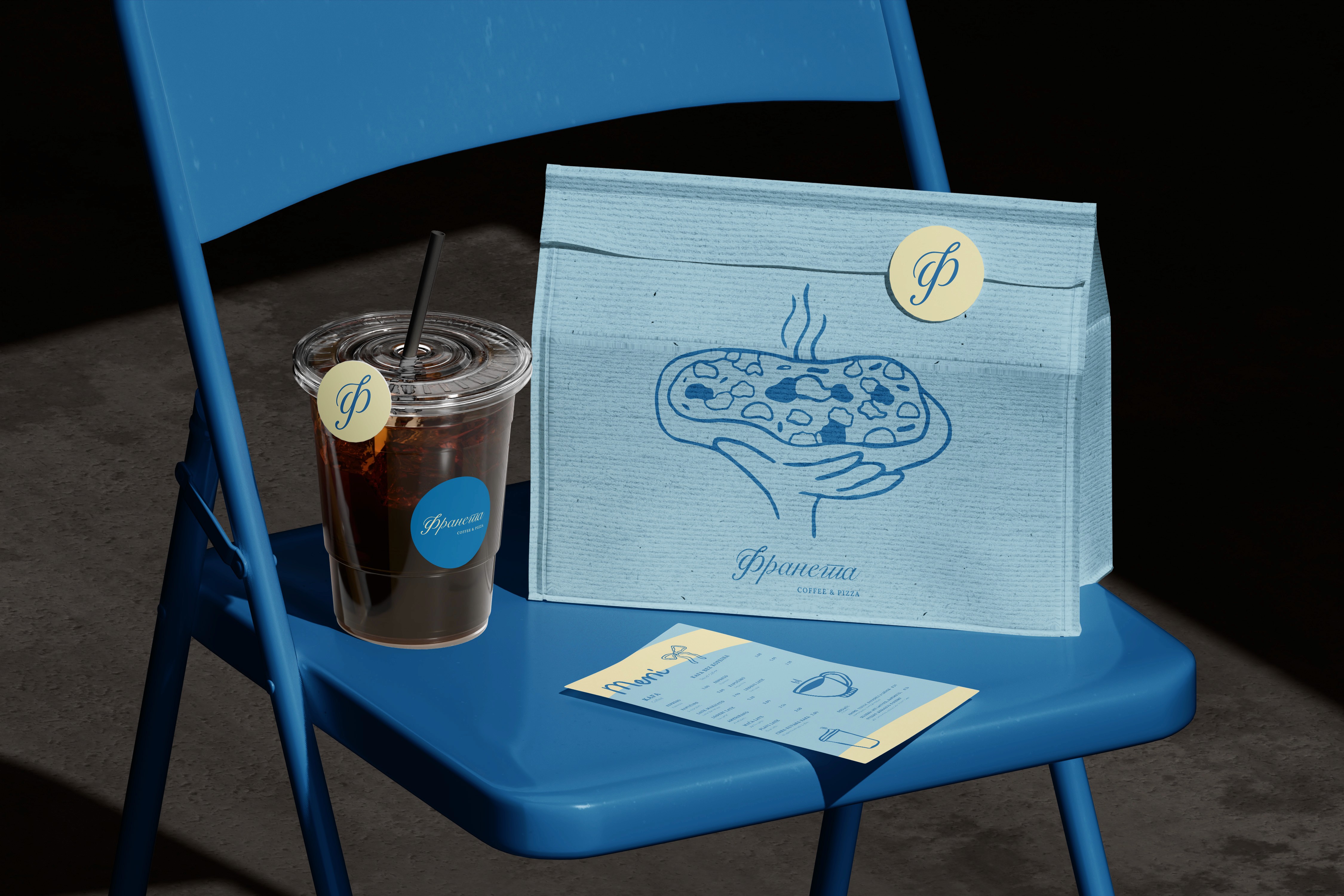 White branded cap with turquoise logo placed on fresh lemons in a red bowl