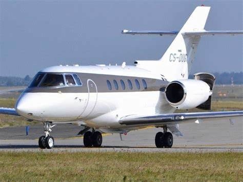 The Hawker 850XP is a mid-sized business jet that was introduced by Hawker Beechcraft Corporation in 2006 as an upgrade to the Hawker 800XP.      It has an increased range, improved avionics, and a redesigned interior. It can carry up to 8 passengers and 2 pilots, and has a maximum range of 2,642 nautical miles (4,892 km).     The Hawker 850XP is powered by twin Honeywell TFE731-5BR turbofan engines, each providing 4,660 pounds of thrust. It has a maximum cruising speed of 448 knots (829 km/h), and can reach an altitude of 41,000 feet (12,497 m).      The cockpit features a Honeywell Primus Epic avionics suite with digital displays and electronic charts.     The cabin of the Hawker 850XP is designed for comfort and productivity. It has a height of 5 feet 9 inches (1.75 m) and a width of 6 feet (1.83 m), providing ample space for passengers to move around. It features a club seating arrangement with swivel and recline capability, and a full-service galley with a microwave and coffee maker. The aircraft also has a fully enclosed lavatory.     Overall, the Hawker 850XP is a popular choice for business travellers looking for a reliable and comfortable mid-sized jet.