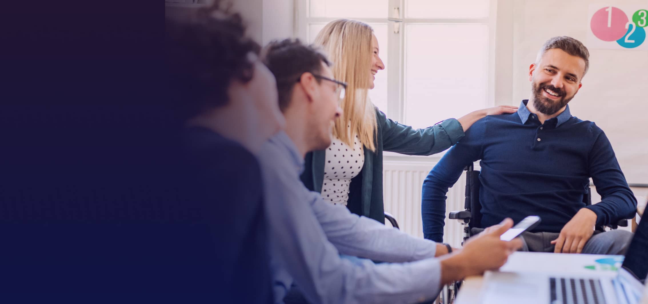 A group of people sitting in the office and enjoying work.