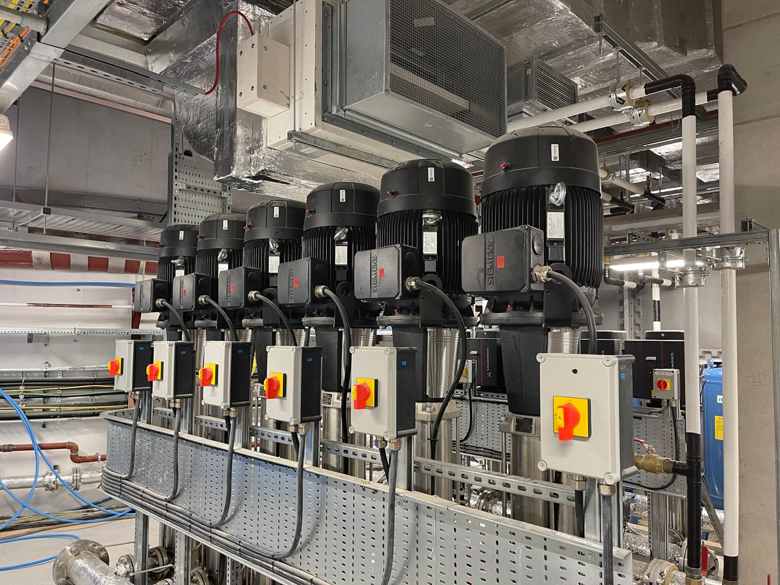 Commercial mechanical plant installation with multiple pump sets and pipework