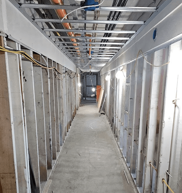 Close-up of metal studs forming walls on a construction site