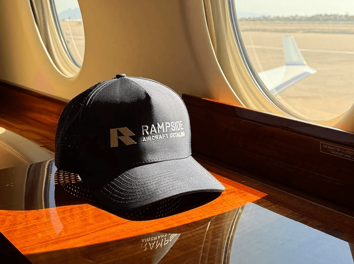 Rampside Aircraft Detailing cap displayed inside a private aircraft cabin