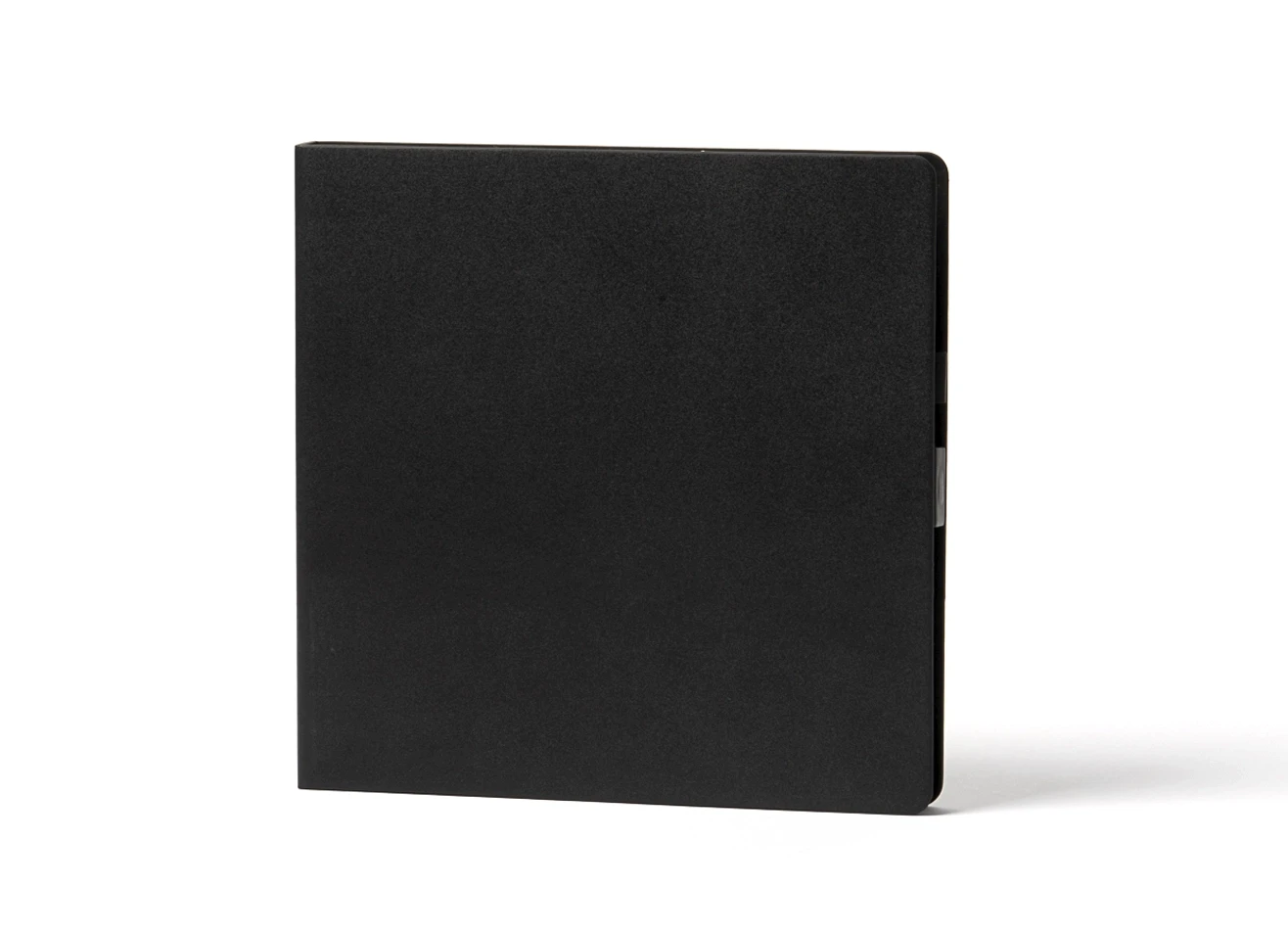 Front view of plain black minimalist notebook.