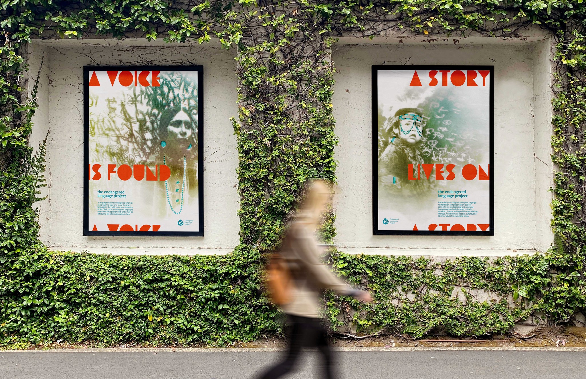 Woman walking past two large, cyanotype posters on a vine-covered wall.