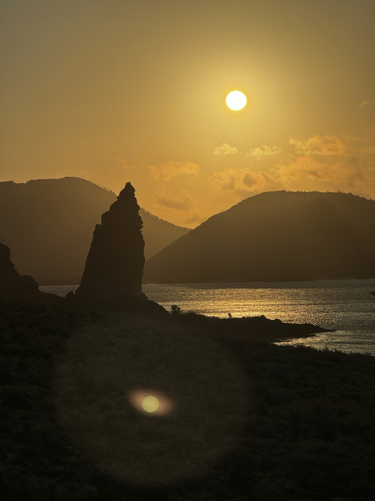 Golden sunset over a rocky coastline