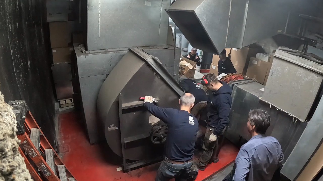 GRR crew removing old return fan housing in hospital mechanical room.