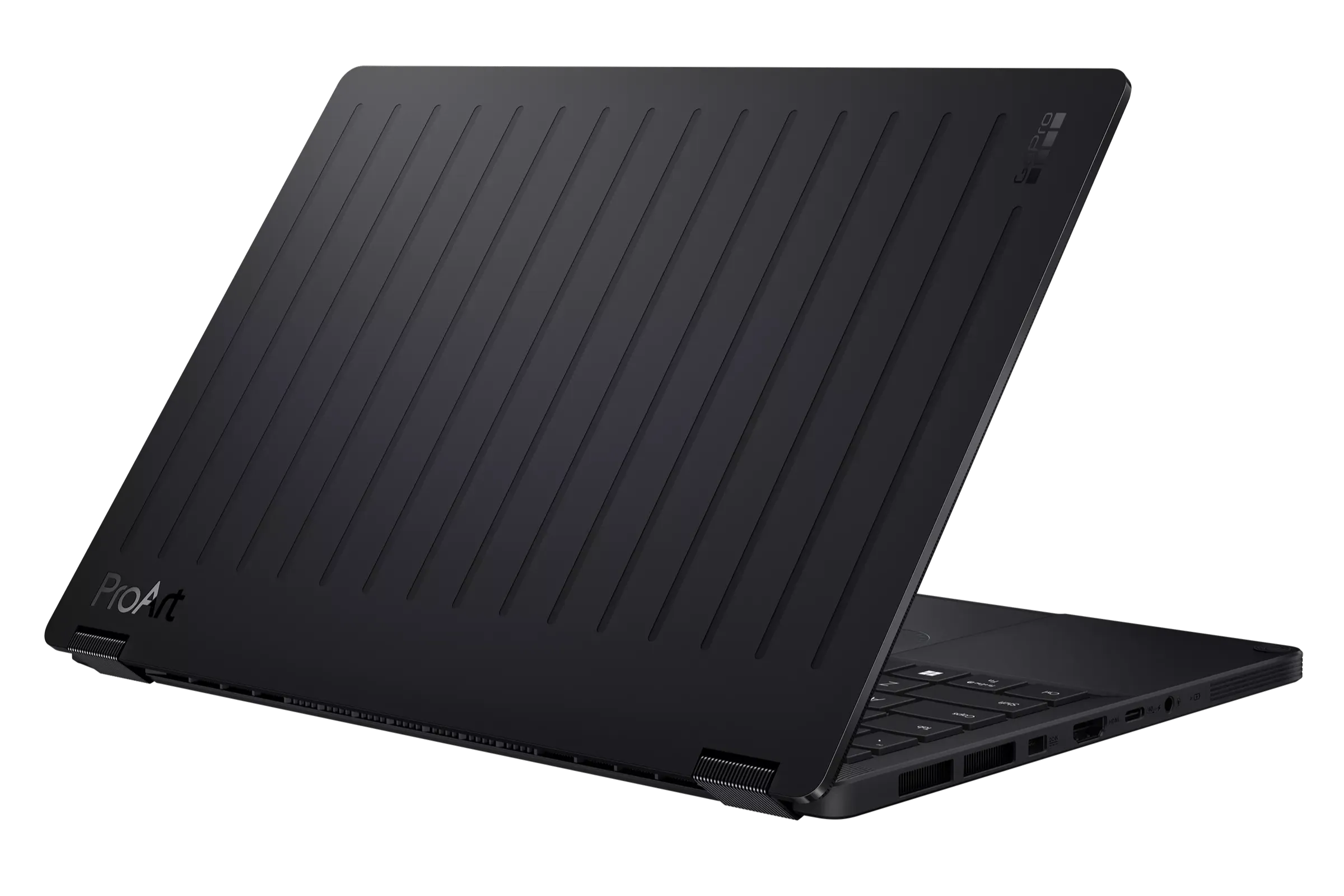 The image shows a sleek, black ASUS ProArt GoPro Edition laptop partially opened, showcasing its modern, textured design with vertical grooves on the lid, highlighting its advanced technological appeal and professional craftsmanship.