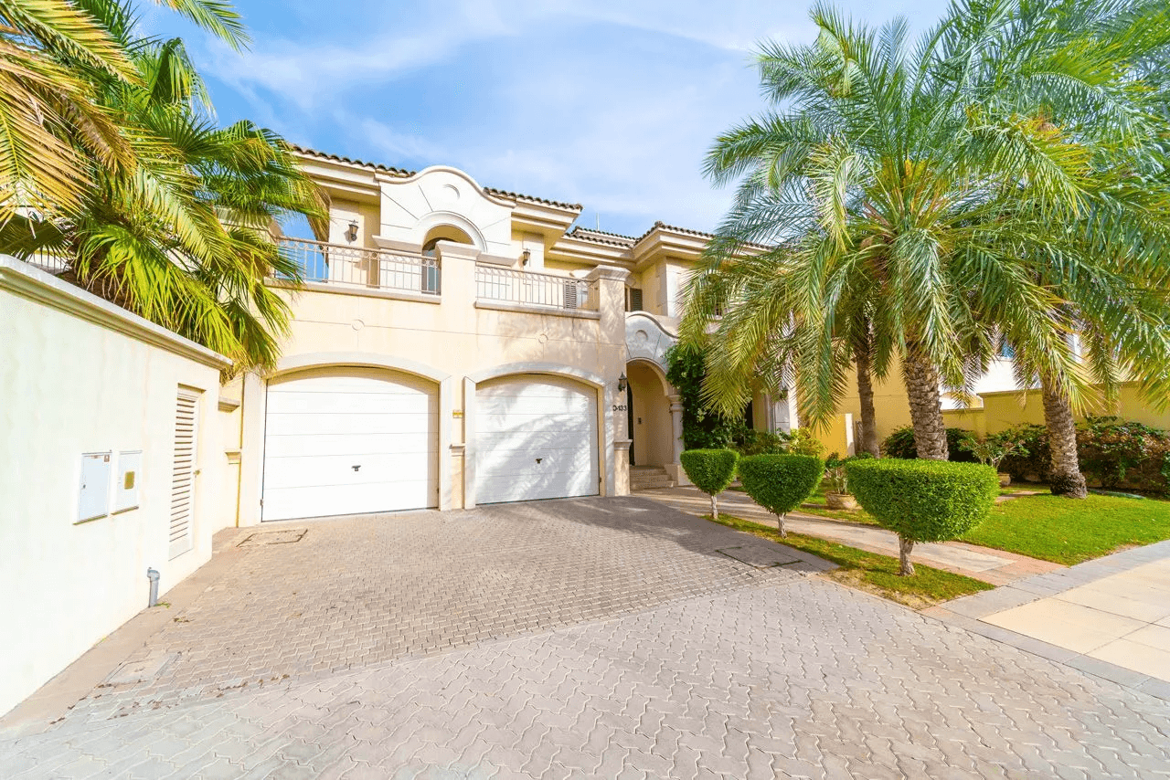 A prominent house with beach access via steps, set within a community of garden homes.