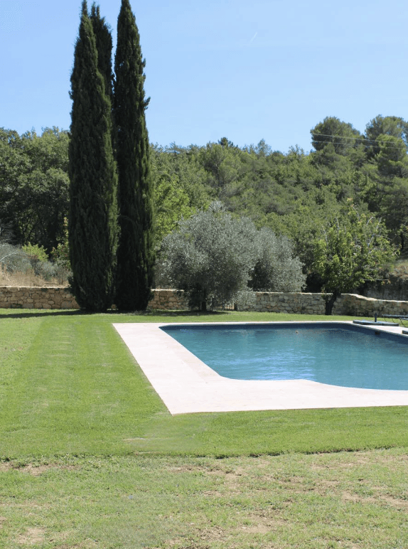 a small wooden building with a wagon in front of it