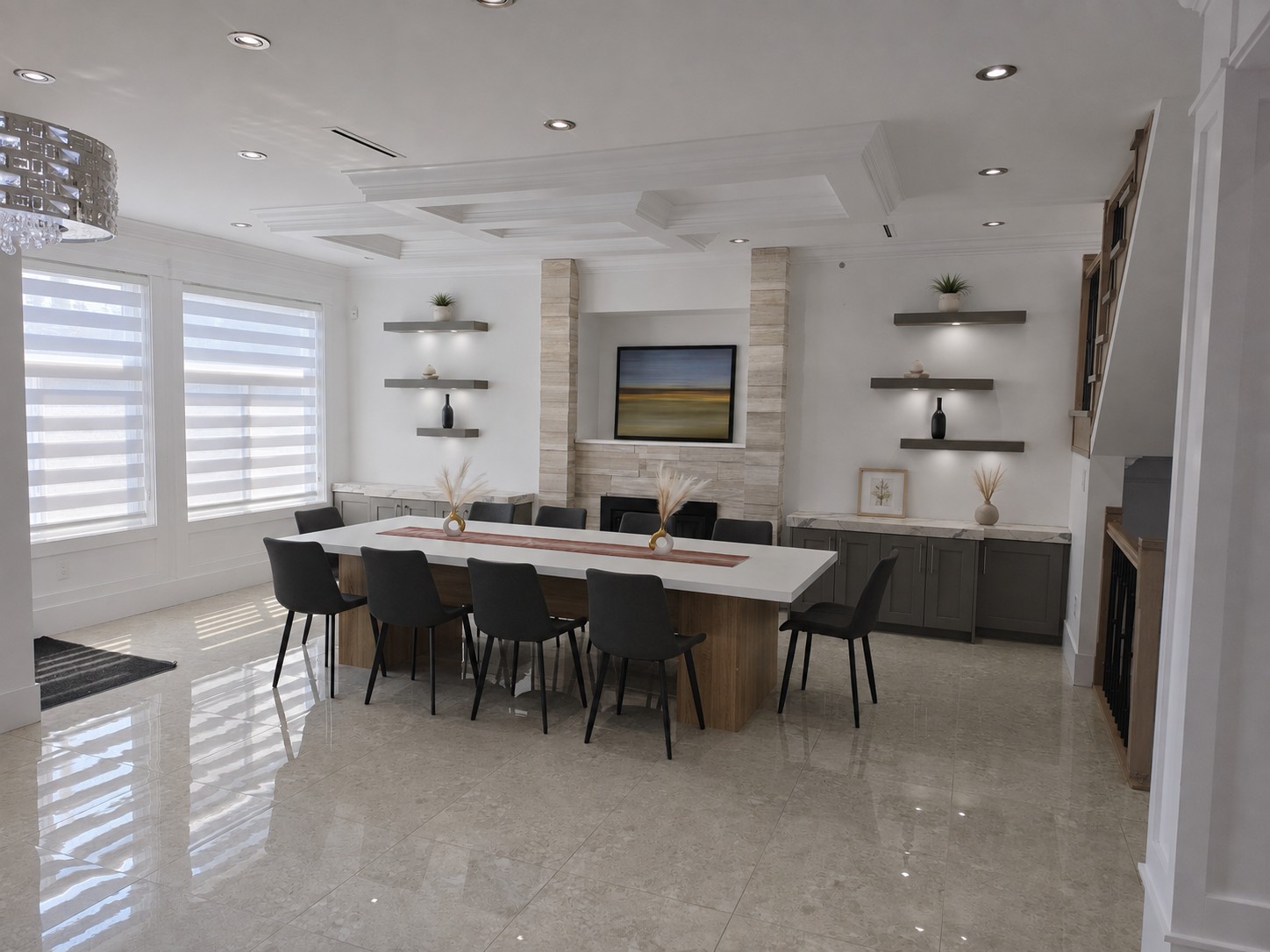 Communal dining room at Olympus House with a large table and fireplace.