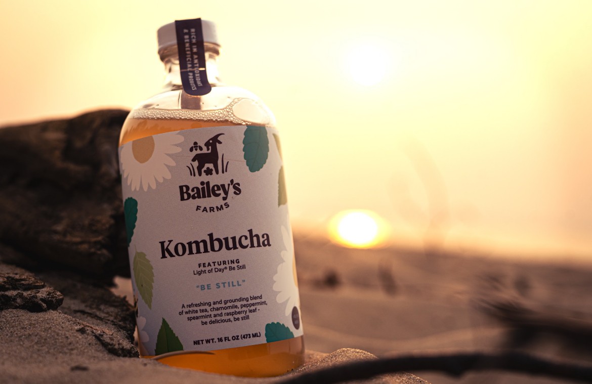 A couple in formal wedding attire embraces intimately in a vast.