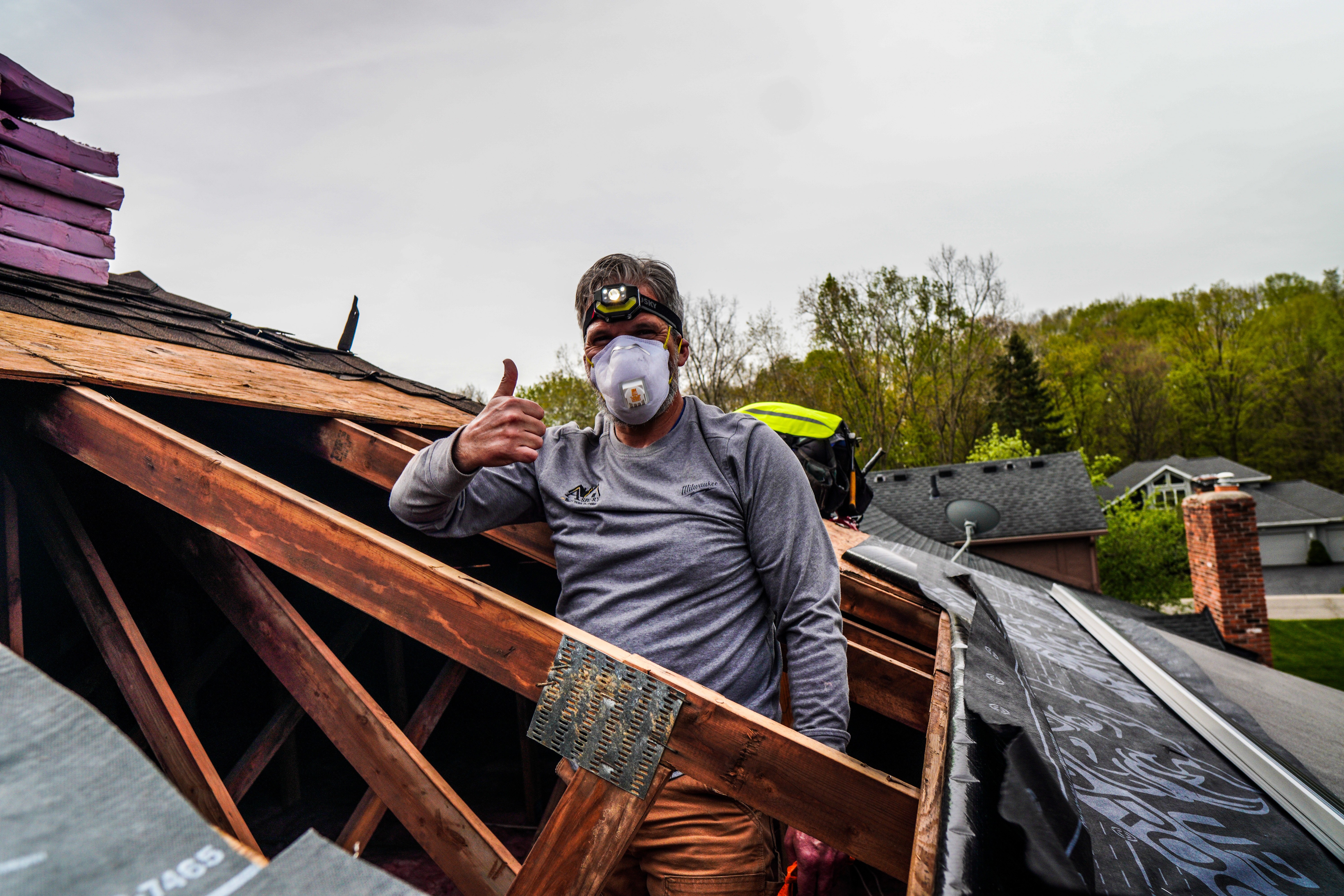 Asbury roofer giving a thumbs up on a residential roofing project