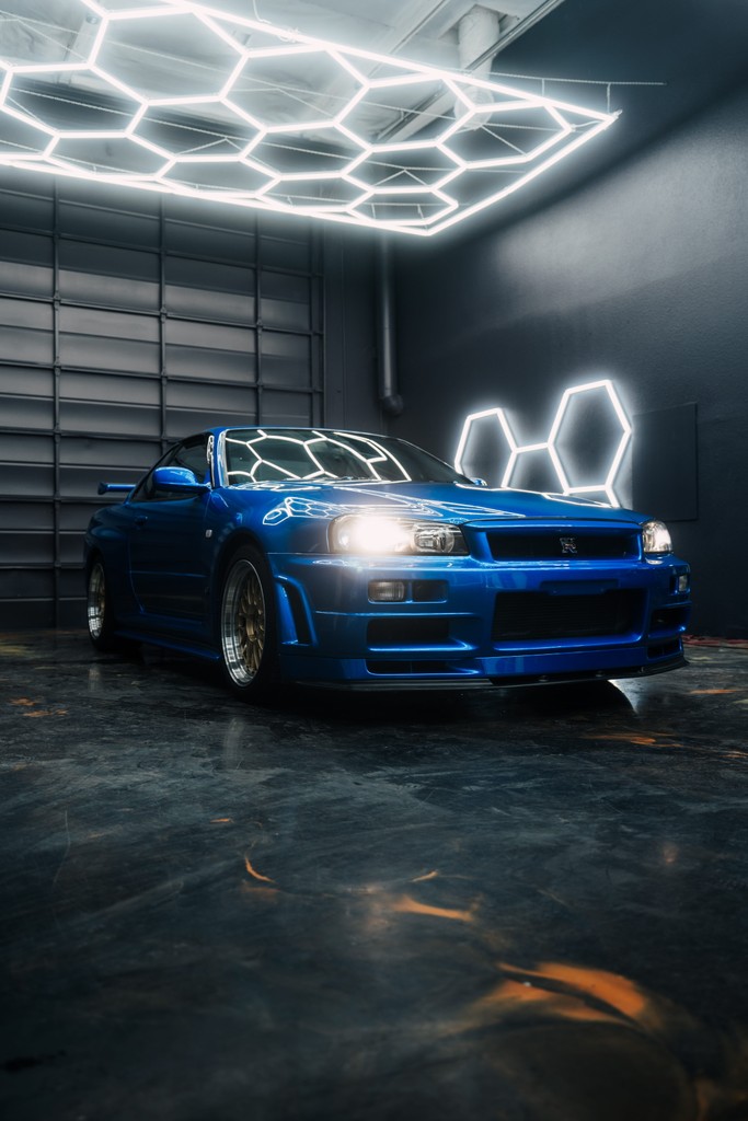 Icon Rocklear permanent paint protection on a blue Nissan Skyline R34 GTR, front three-quarter view, Dragon Auto Milpitas