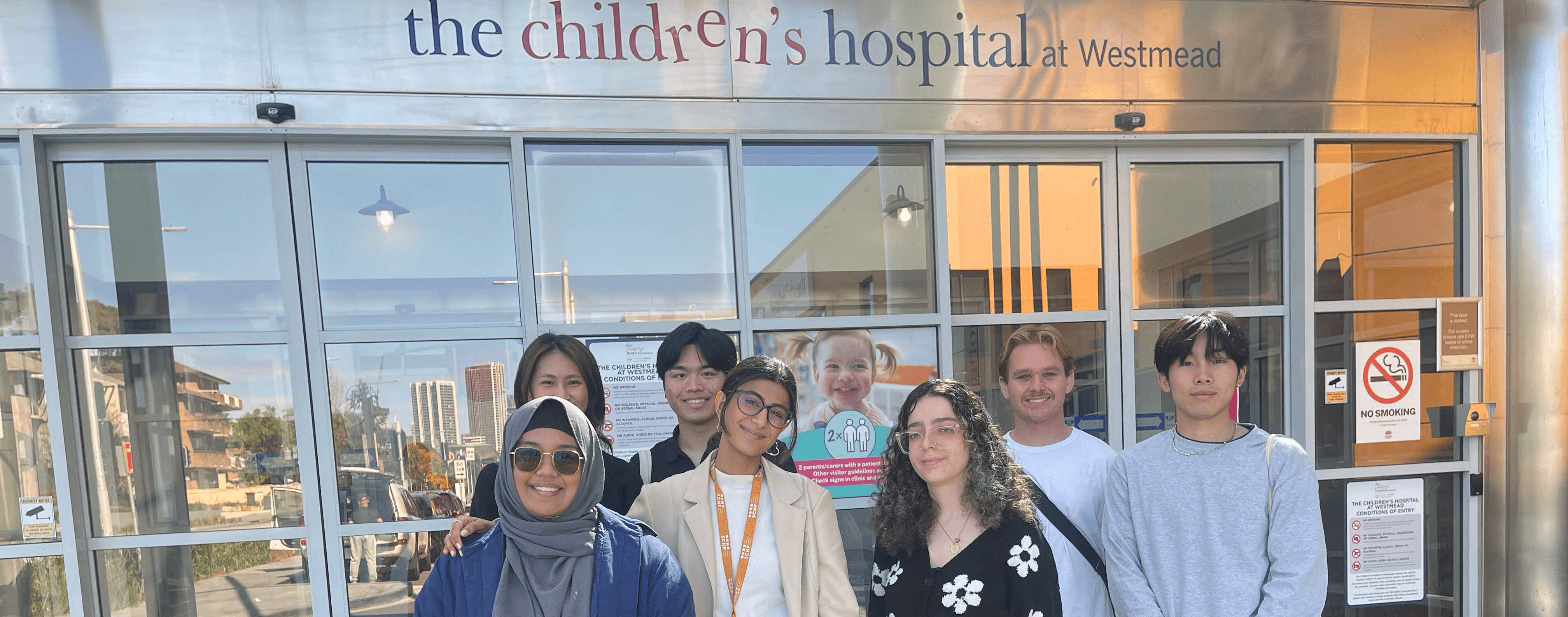 a cellphone leaning against a wall