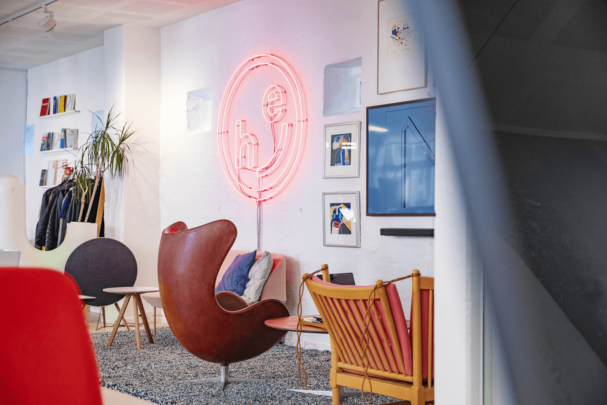 An office interior with an illuminated logo sign.