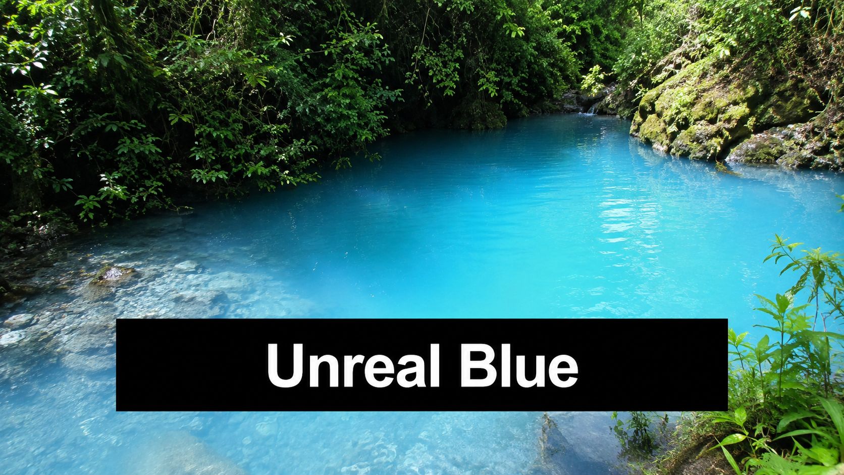 A scenic view of the vibrant, milky turquoise waters of Rio Celeste in the Costa Rican rainforest.