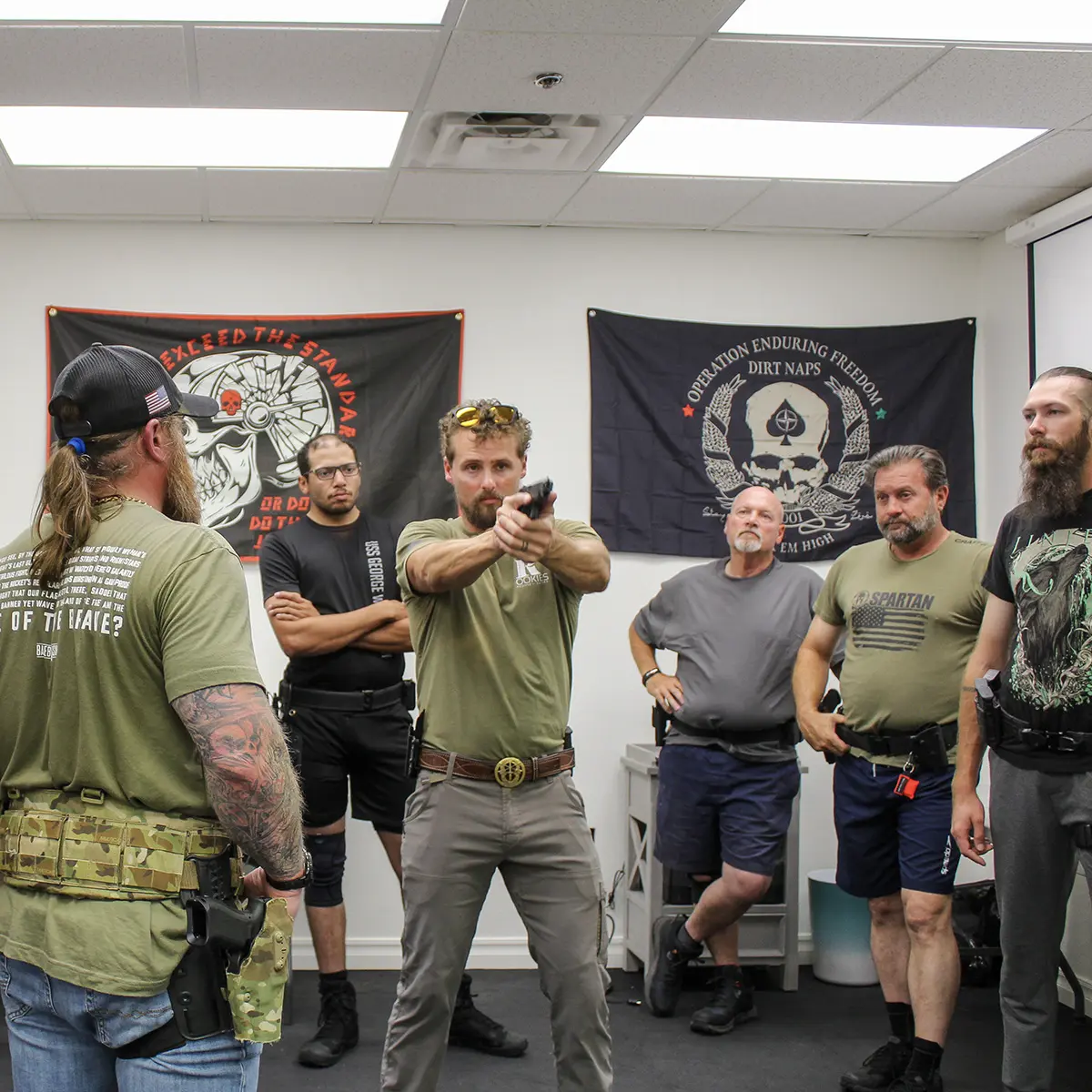 Wasson Protection team members observing professional firearms training and safety demonstration