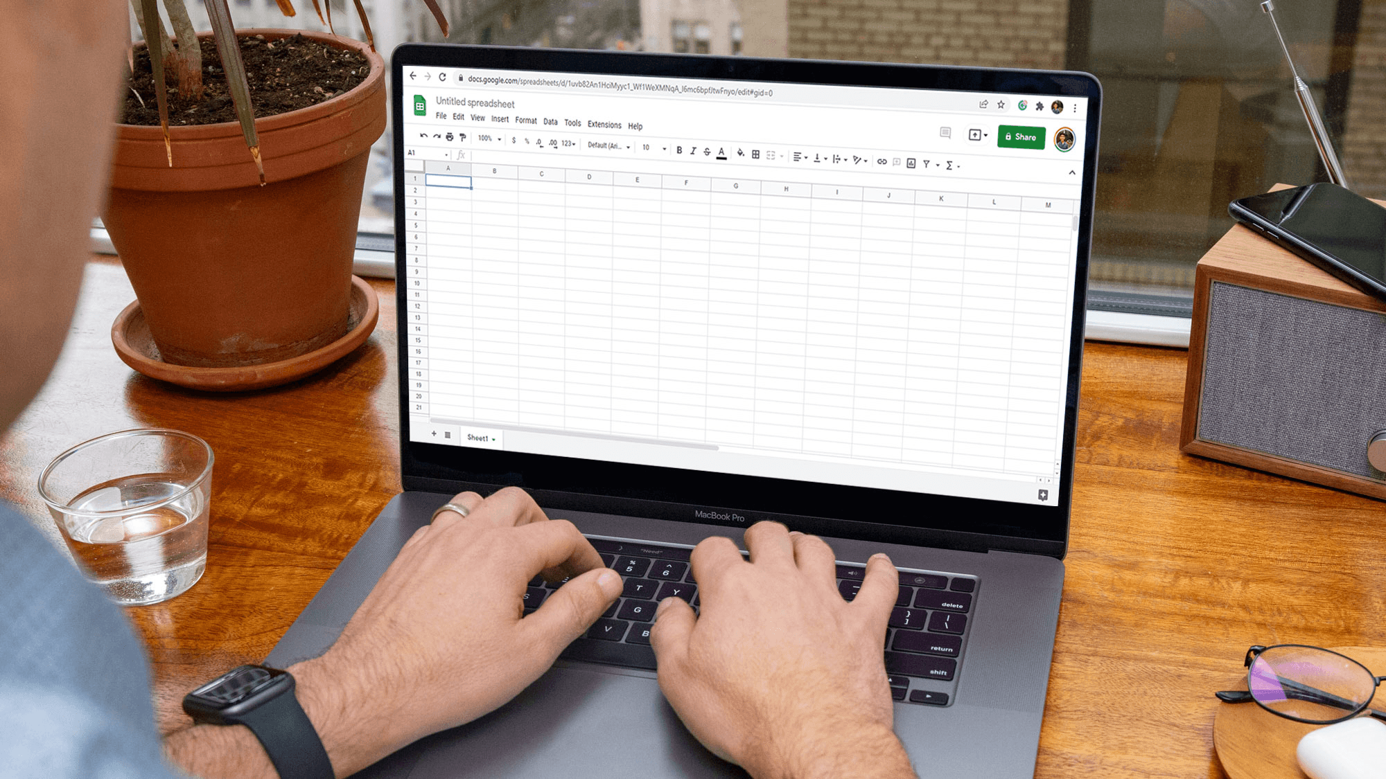  Man typing in a Google Spreadsheet - How to Automate Google Sheets