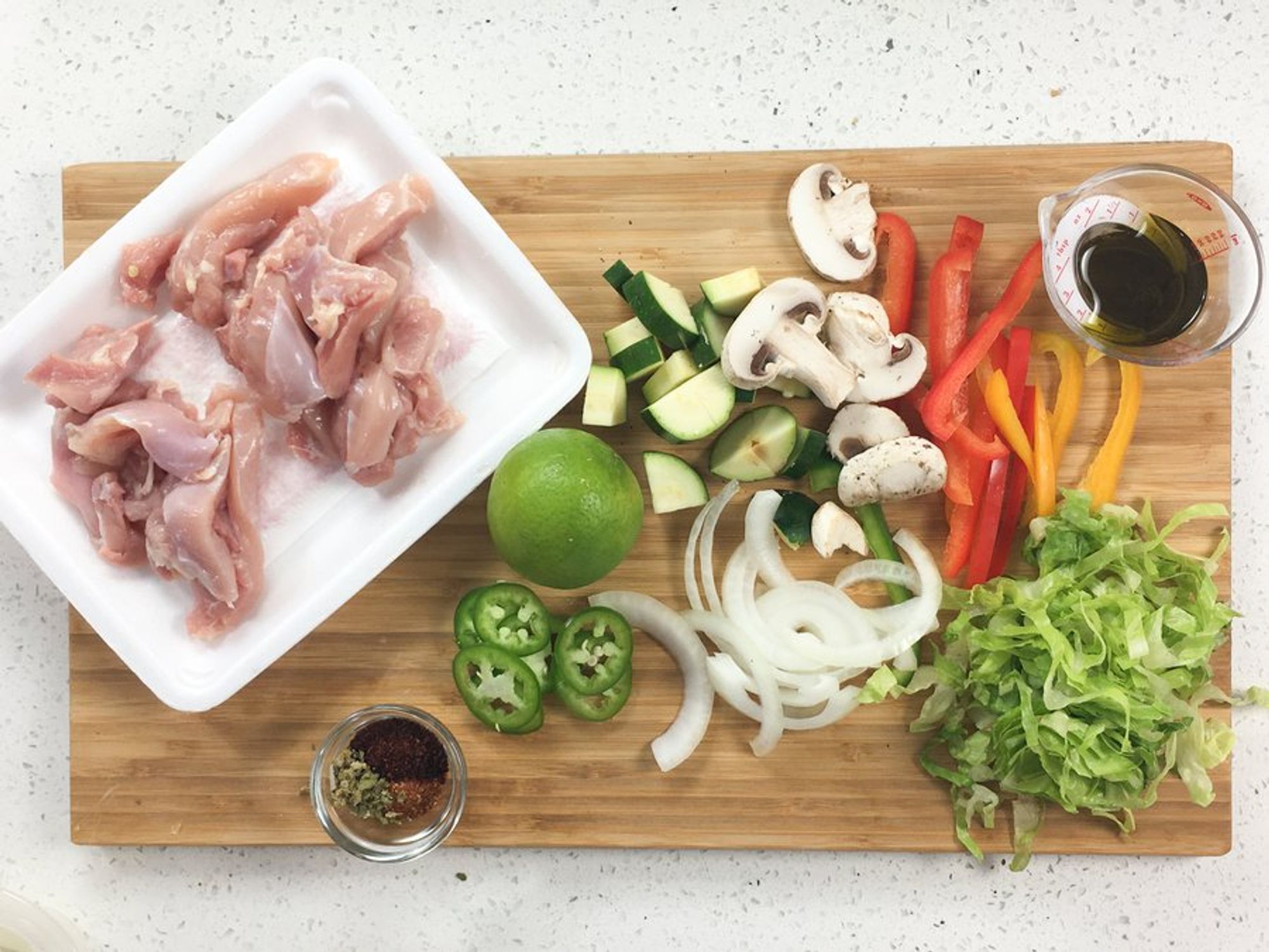 ingredients for chicken and veggie taco bowl