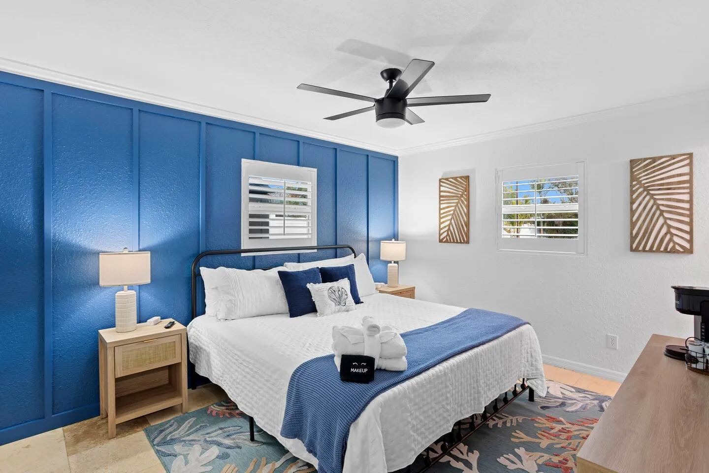 King bedroom with navy accent wall at Pickleball Resort, Bradenton, Florida