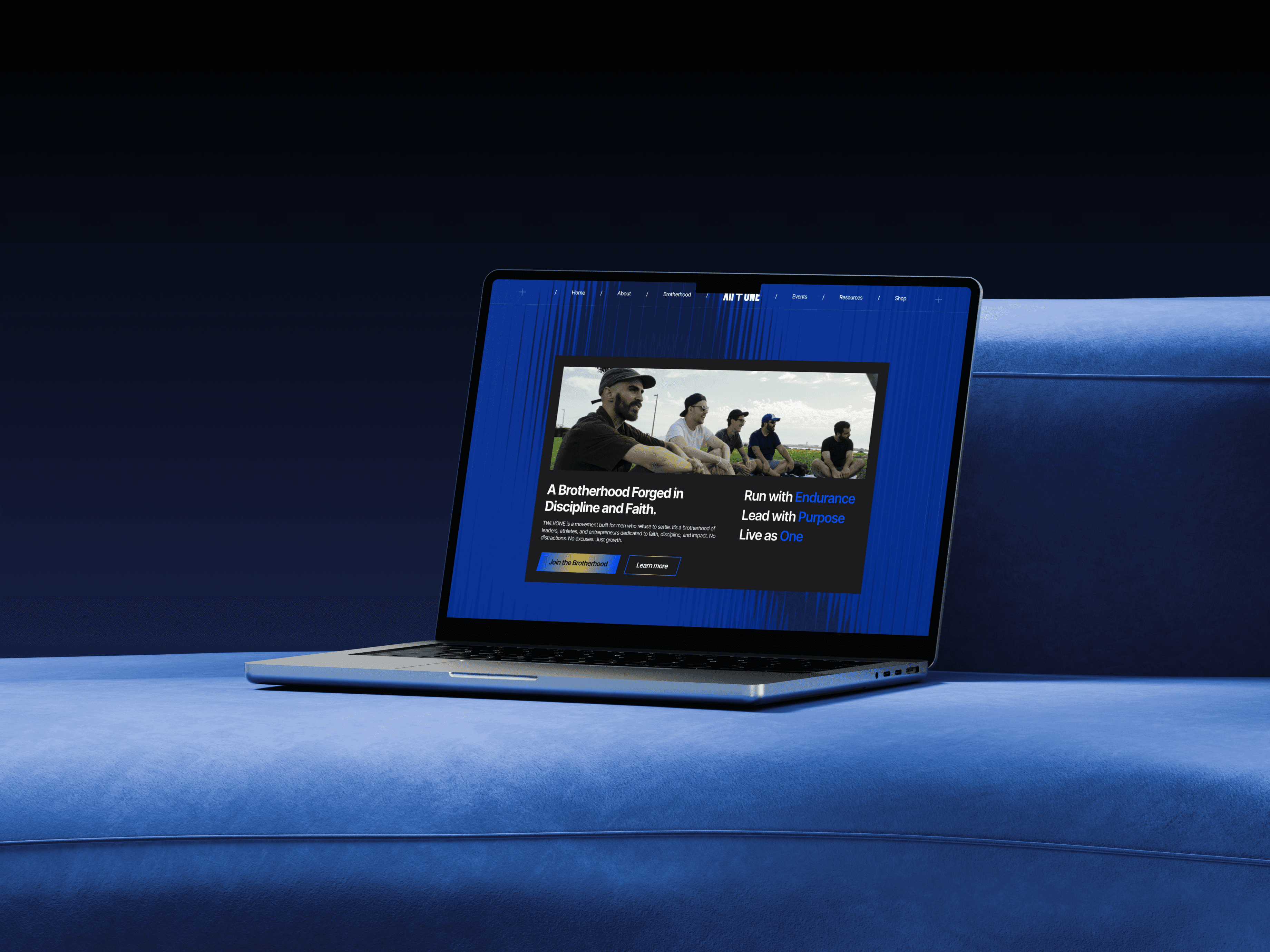 A delicate lotus flower blooms amidst large green leaves.