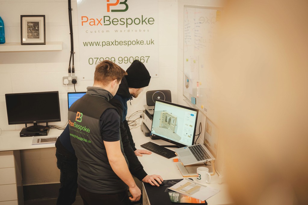 two men looking at a computer screen