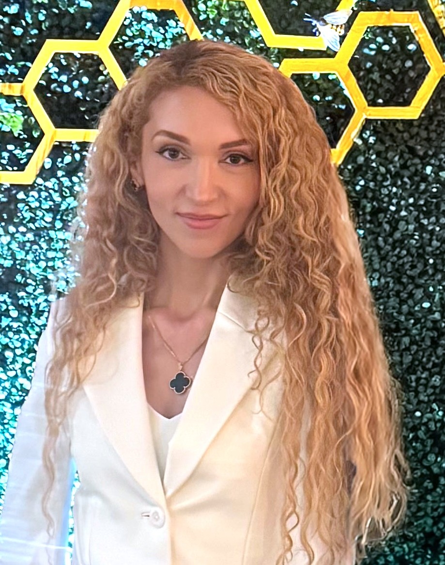 smiling woman in brown blazer