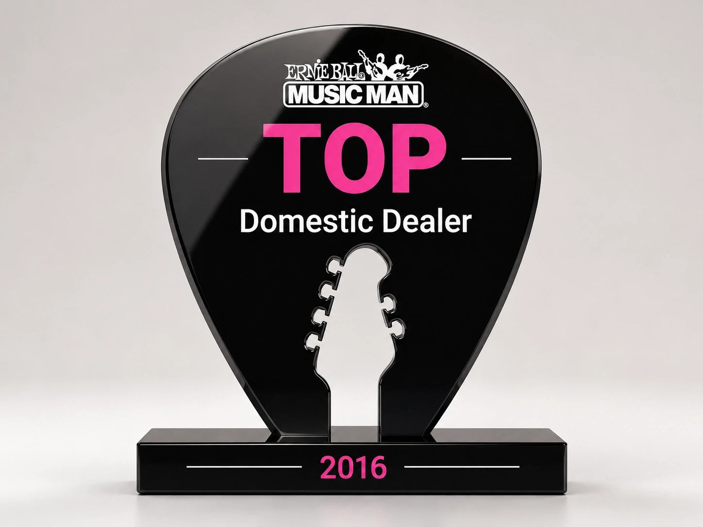 Ernie Ball Music Man Award in shape of pick with headstock cut out of center