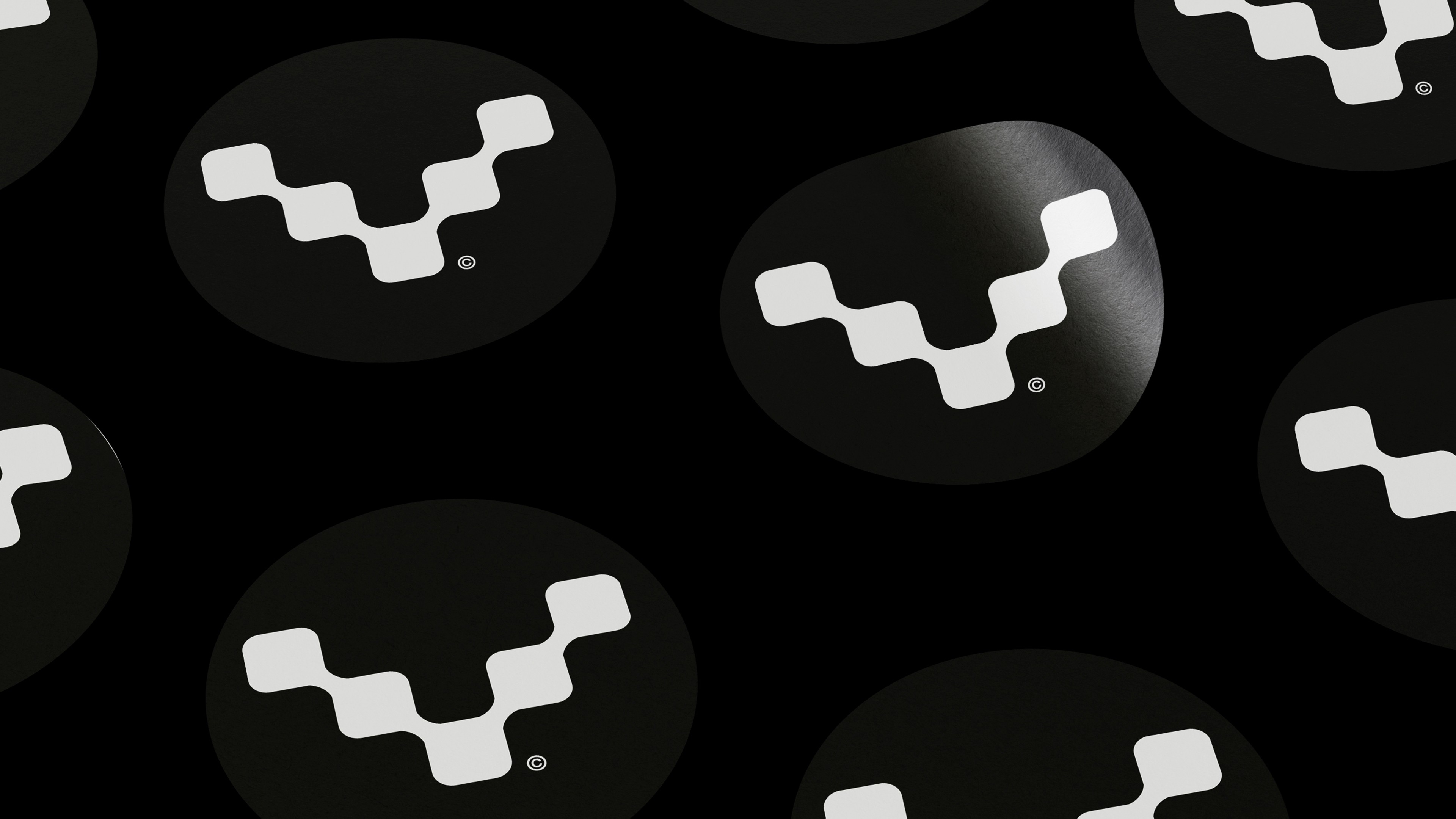 Modern home office setup with a monitor, ergonomic chair, keyboard, and indoor plants near a window with blinds.