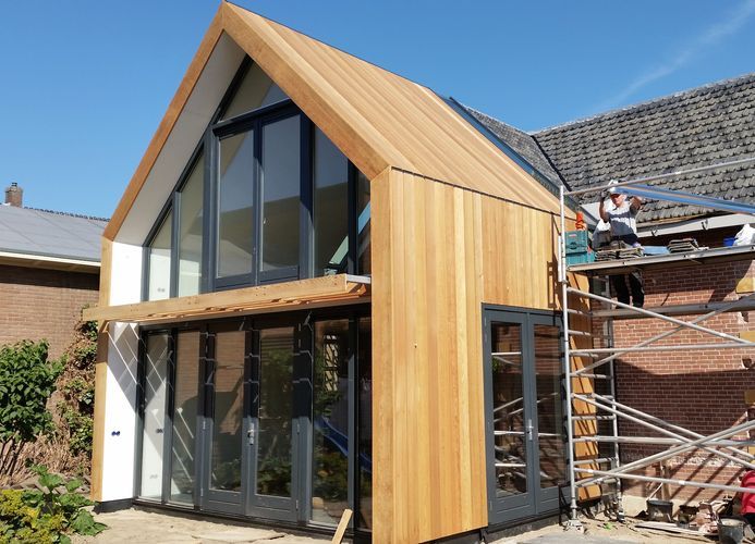 People dining and working in a modern cafe.