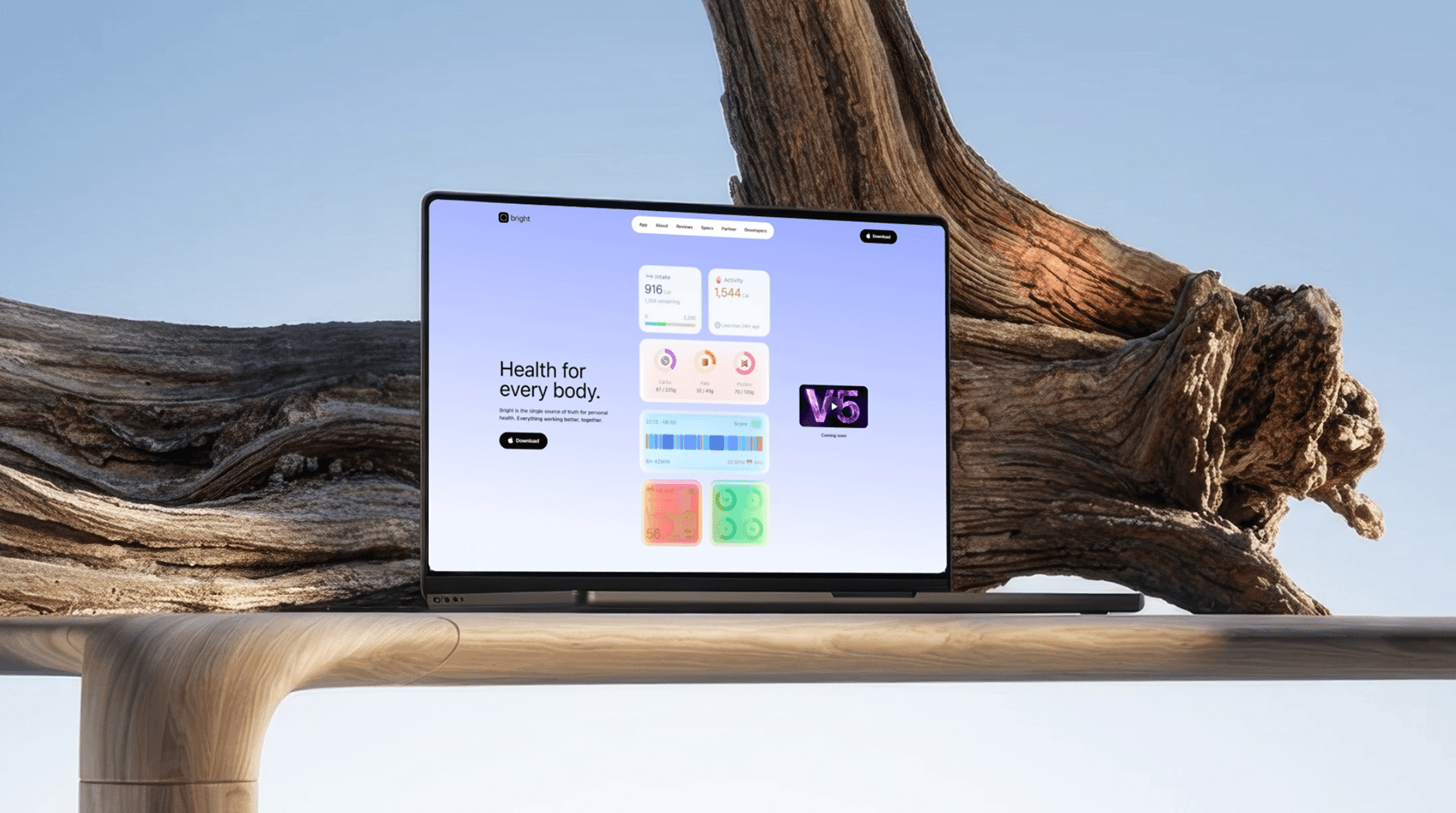 Image featuring a greyscaled laptop and phone devices on an abstract background.