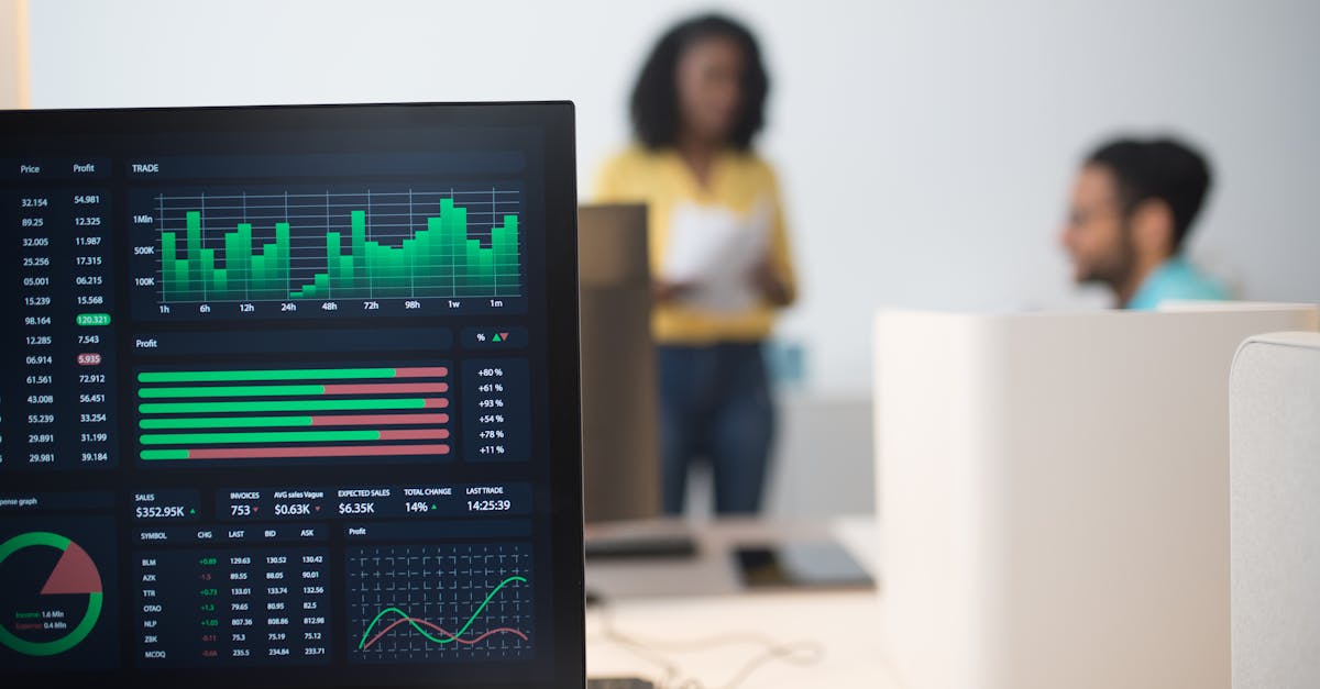 Modern office with financial trading screens and a diverse team discussing strategies.