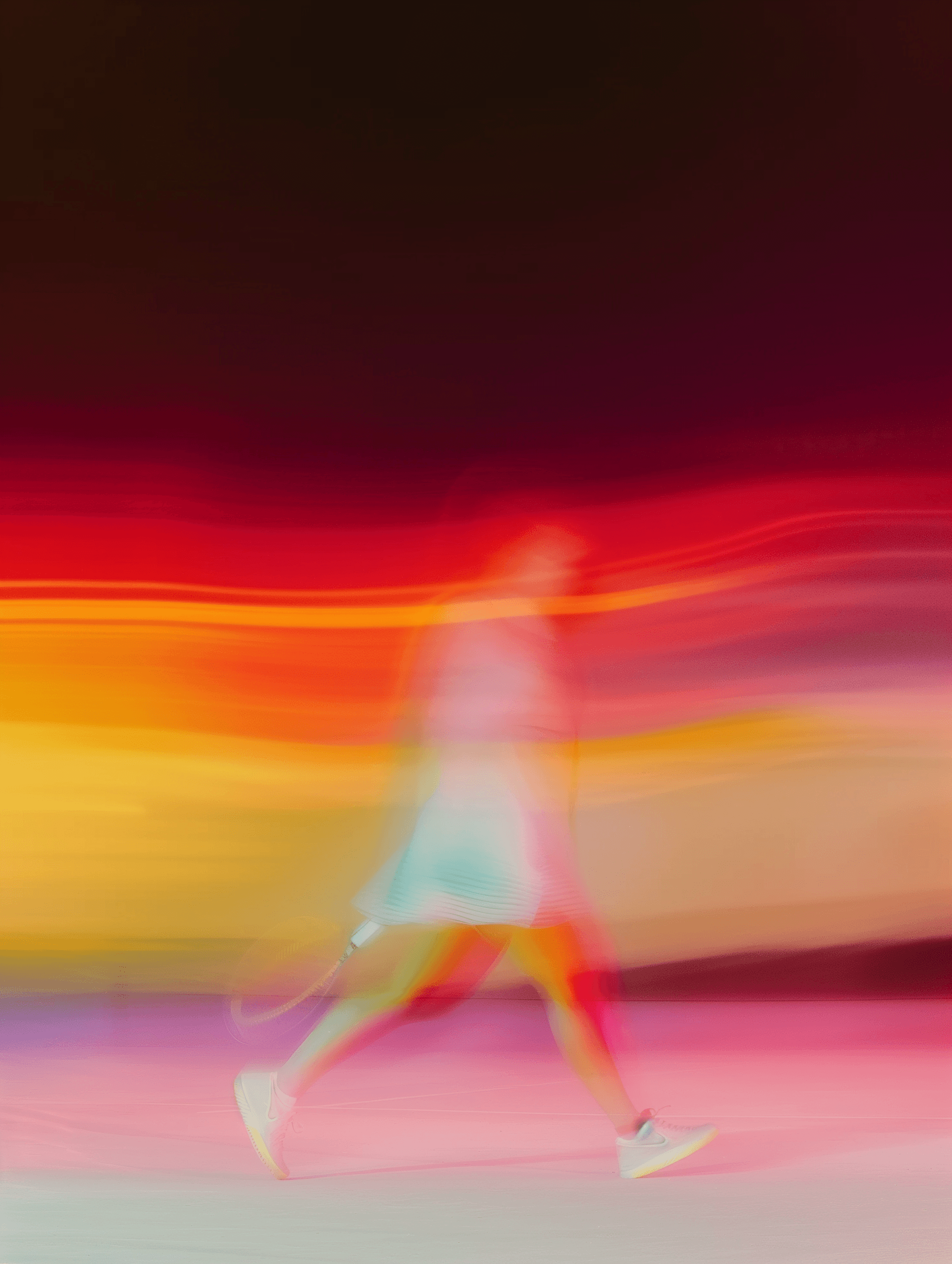 Vibrant abstract image with warm red, orange and yellow tones, evoking the energy of a live performance.