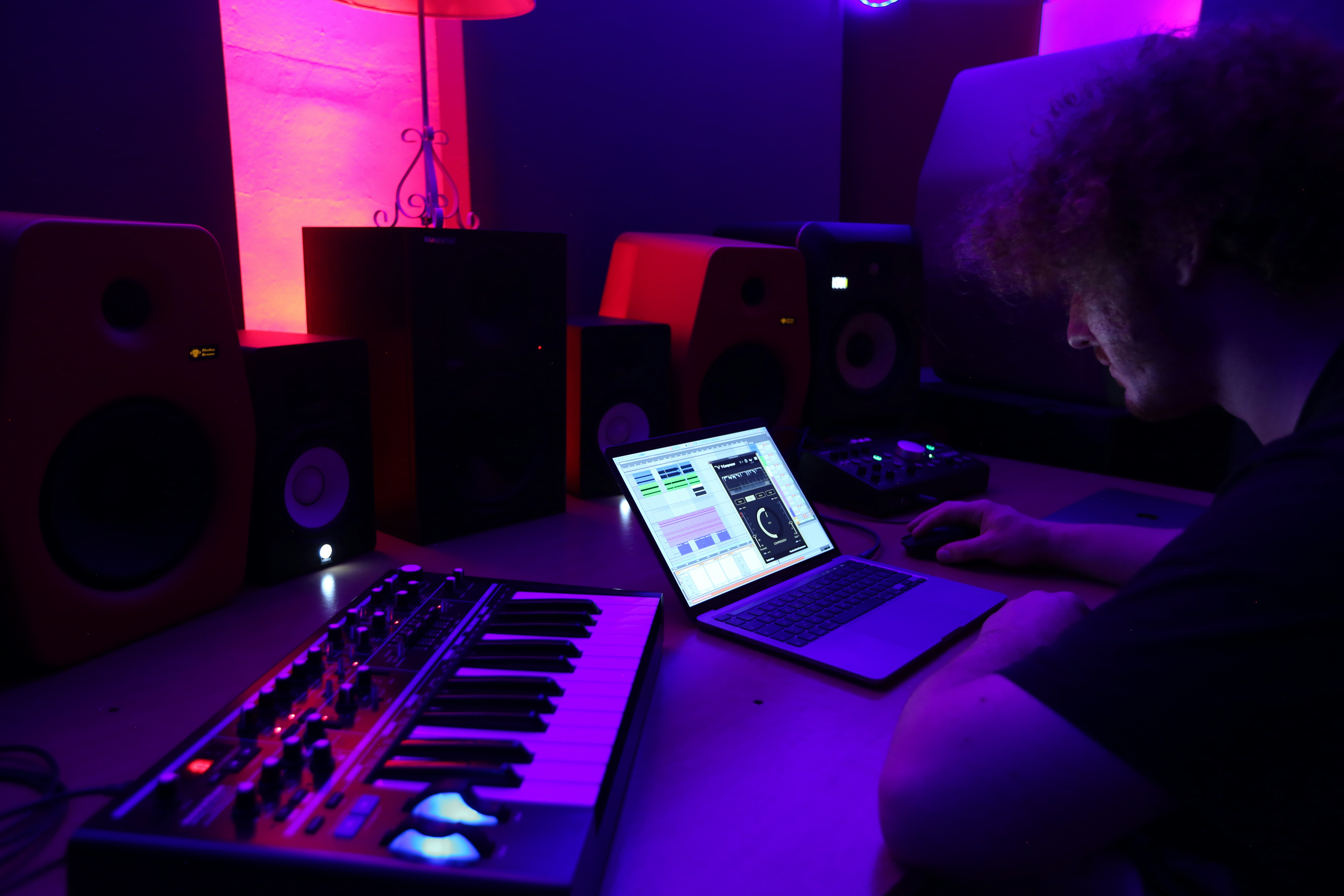 man in his studio working from Music Production Blogs