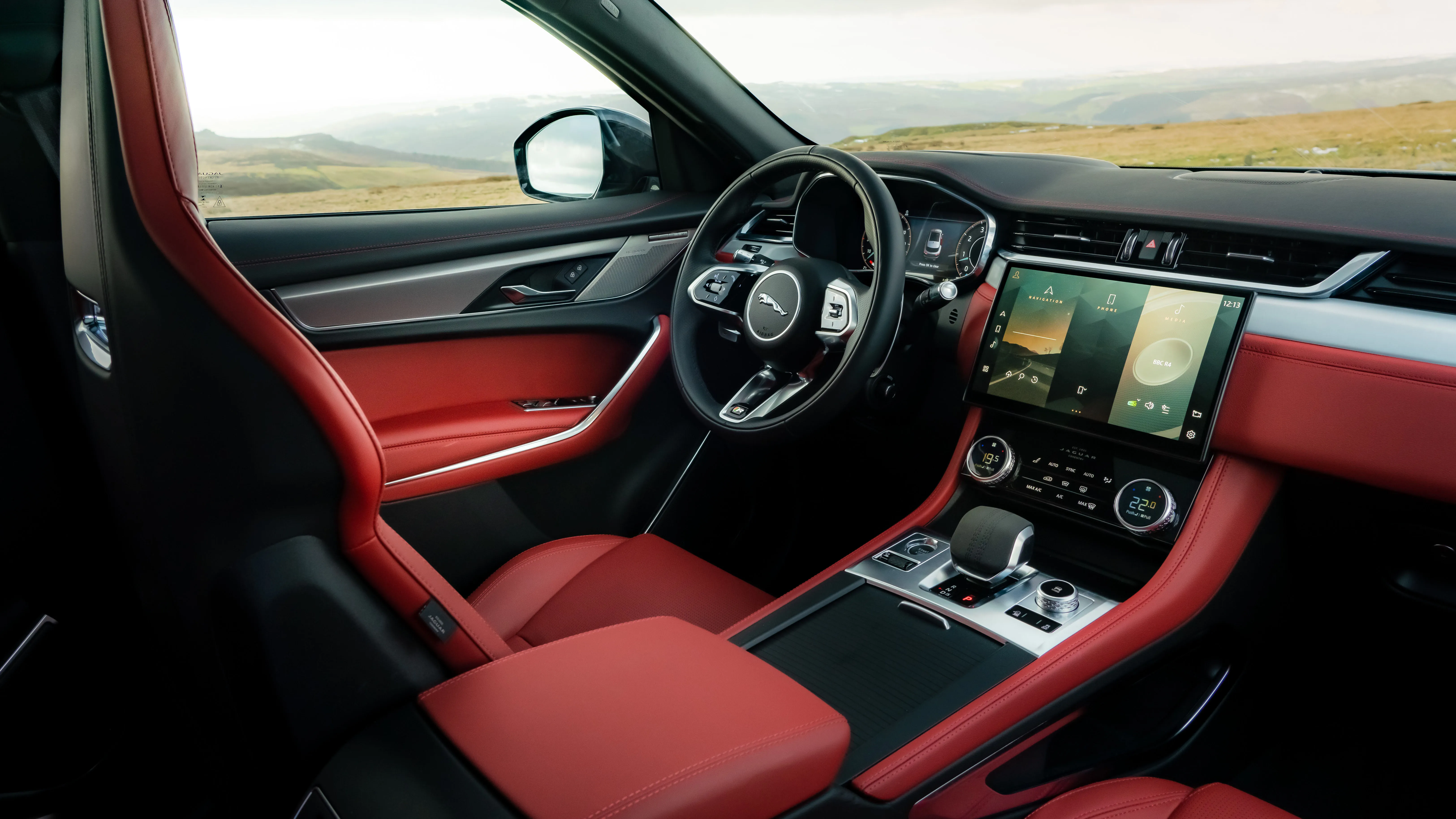 Luxury SUV interior with red leather seats