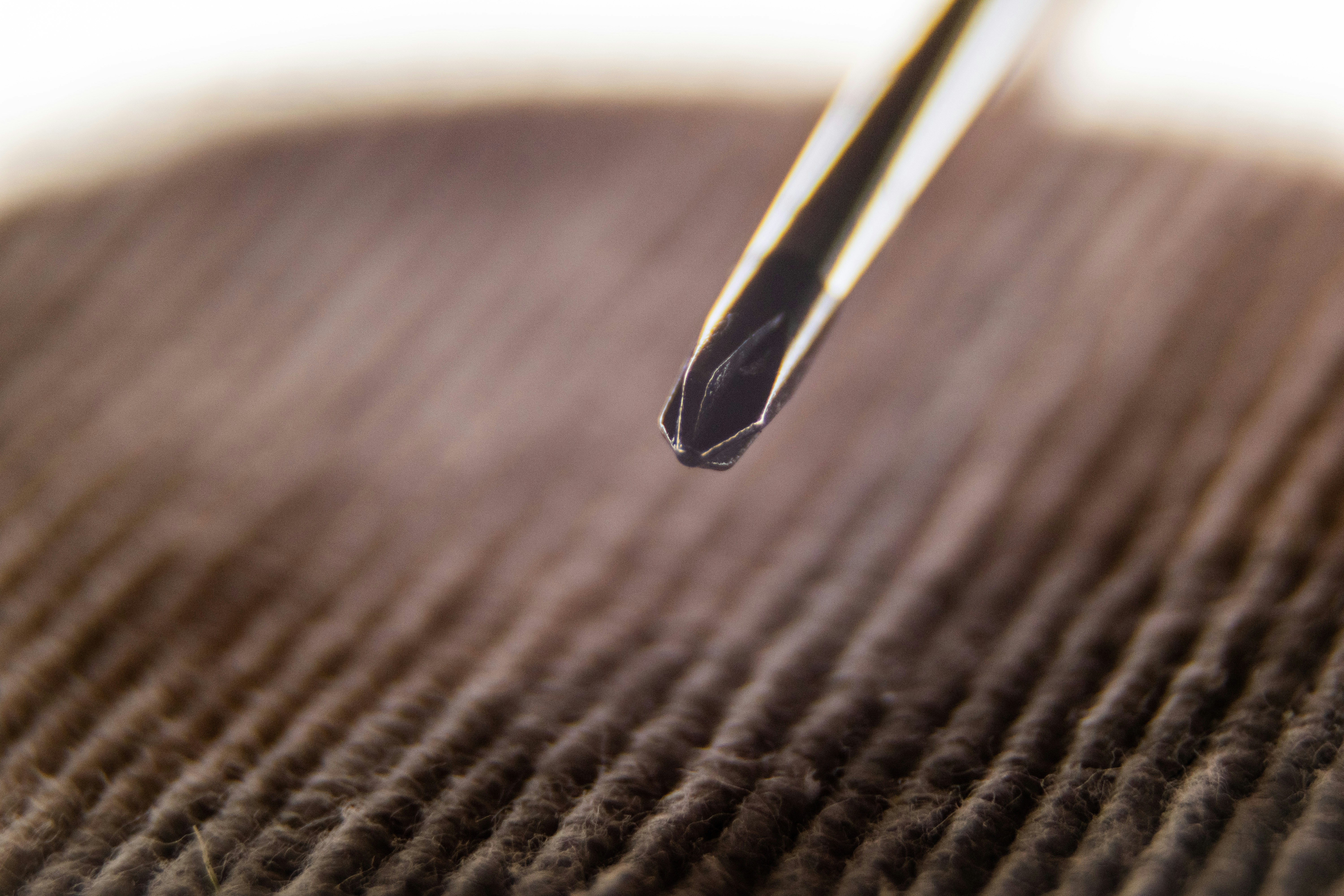 black and yellow pen on brown textile