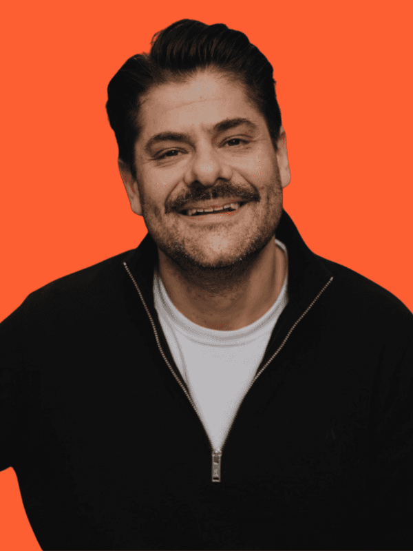 Close-up of a tree stump showing growth rings and a textured brown wood surface.