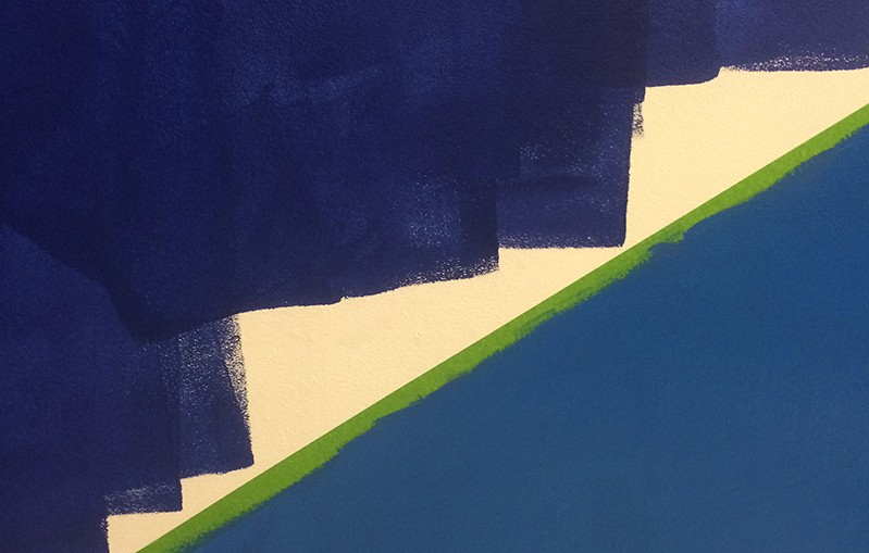 a wall painted in two halves of different shades of blue