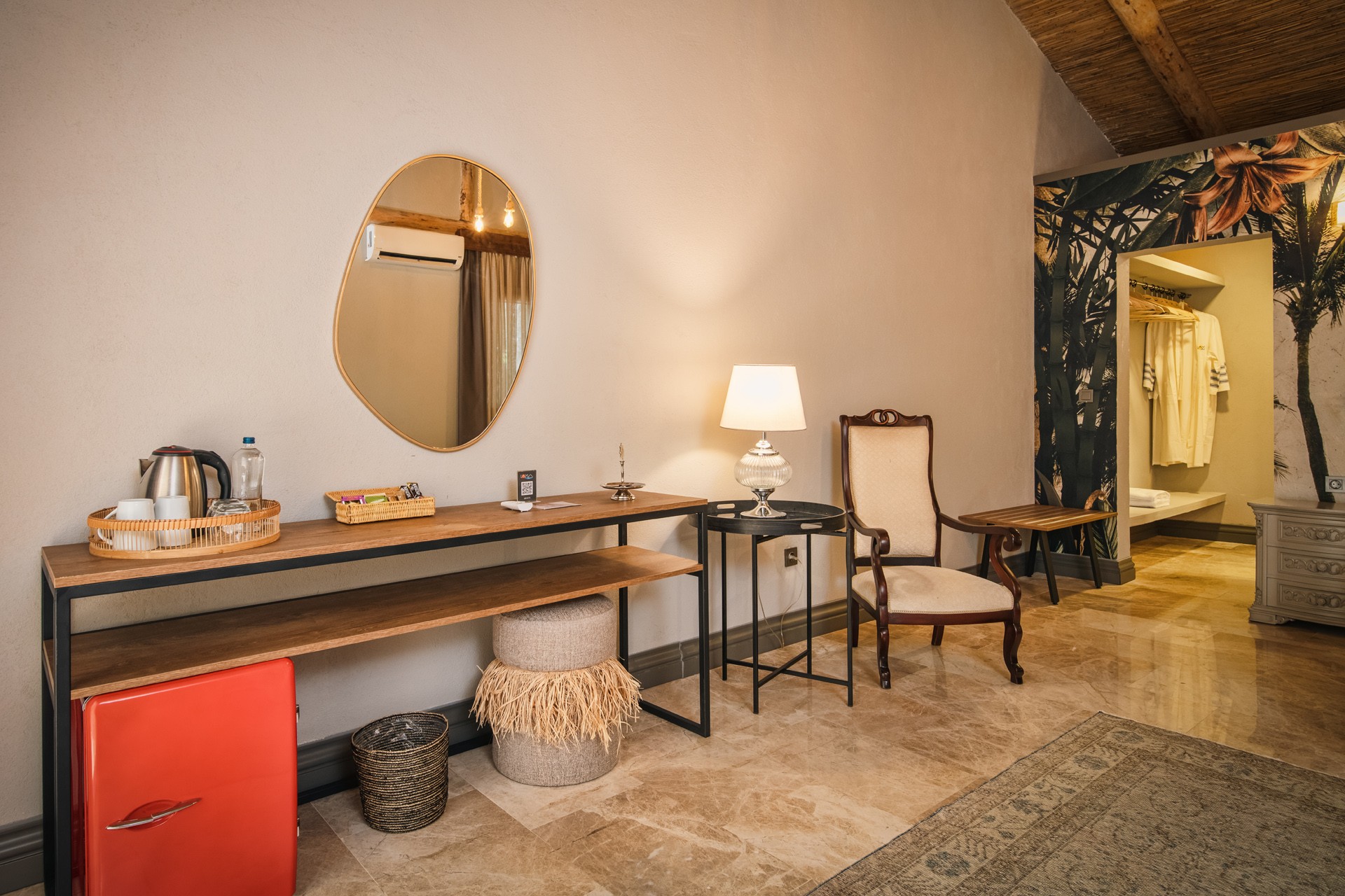 Living area composition, mid-century modern sofa, light wooden coffee table, woven textures, and curated coastal decor.