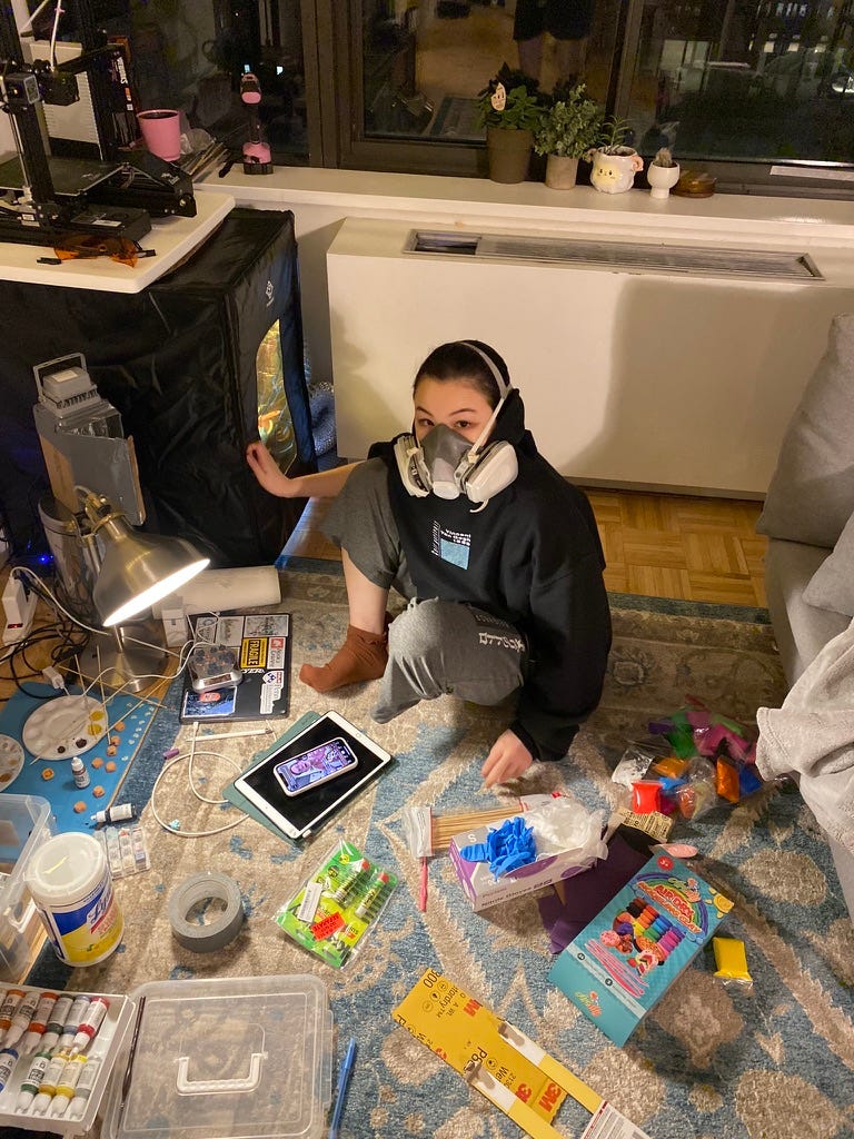 A person wearing a mask sitting on the floor

AI-generated content may be incorrect.