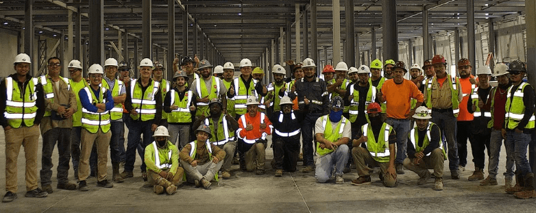 QBS Construction site team inside large-scale industrial warehouse facility